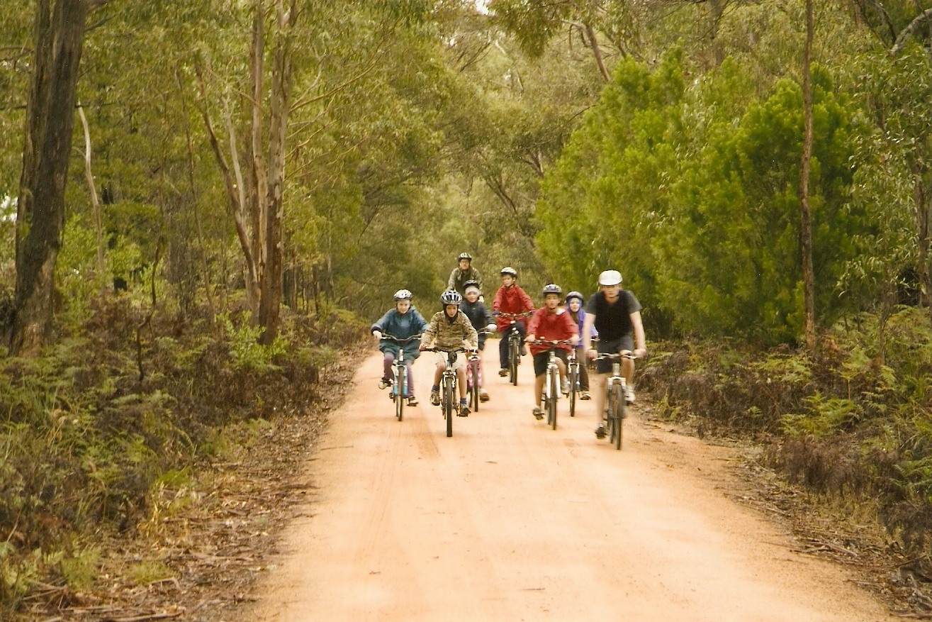 bike riders on a dirt road